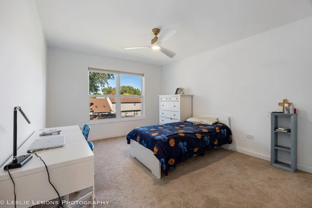 a bed room with furniture and a window