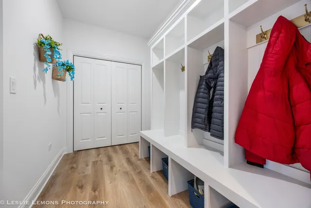 a view of an entryway with wooden floor