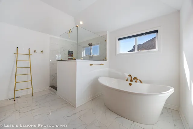 a white bath tub sitting in a bathroom