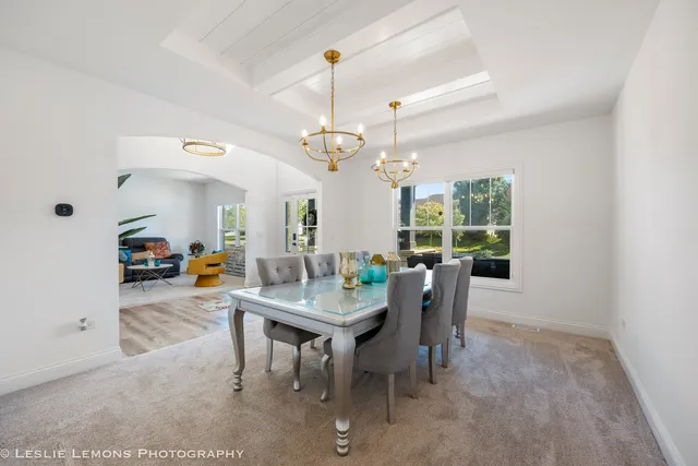 a dining room with furniture and window