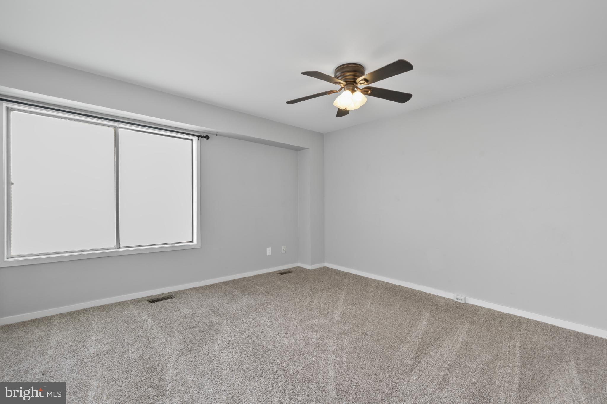 9802 Sailfish Terrace Gaithersburg, MD 20886 - Photo 12 of 18 a view of an empty room with a window