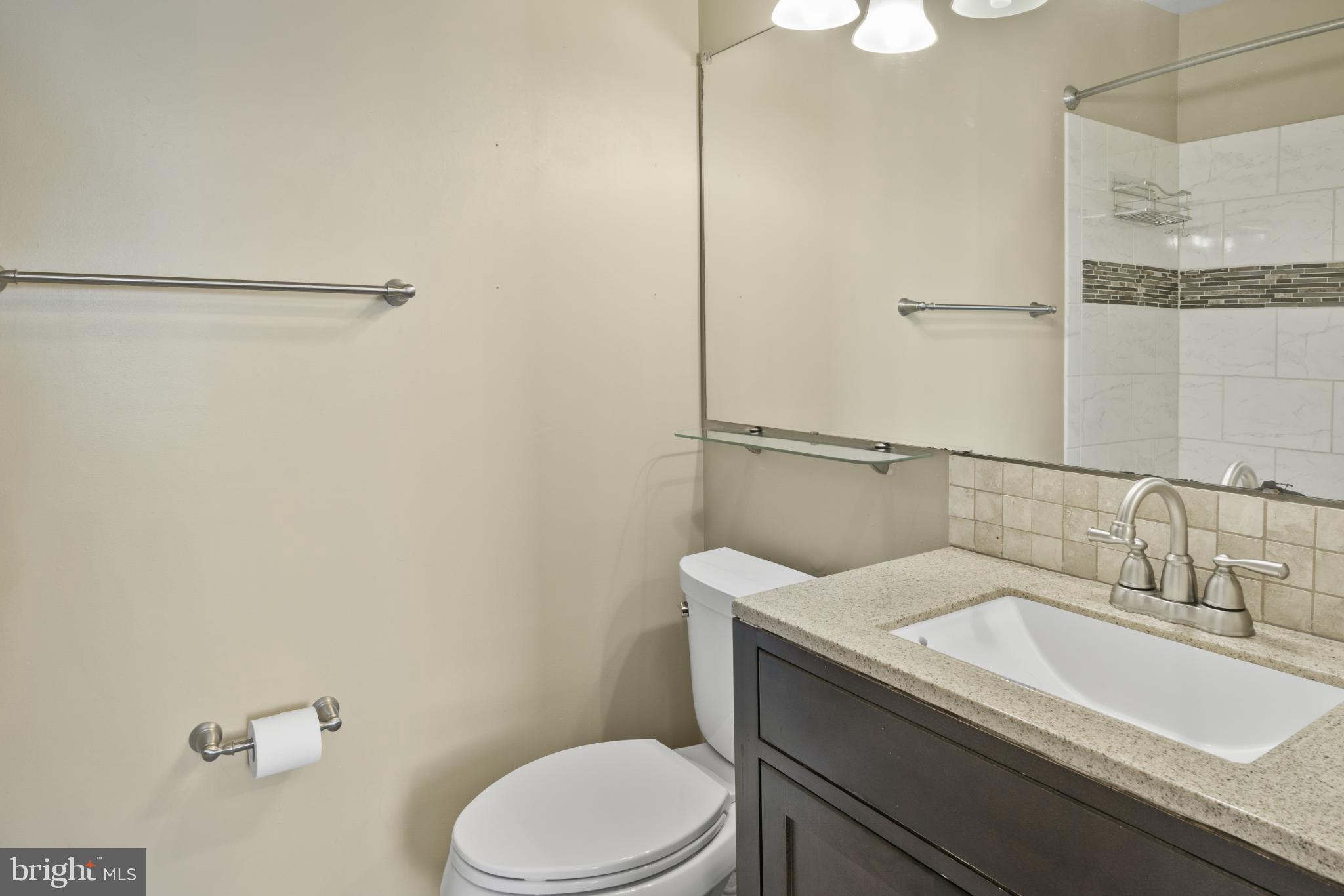 9802 Sailfish Terrace Gaithersburg, MD 20886 - Photo 15 of 18 a bathroom with a sink a toilet and shower