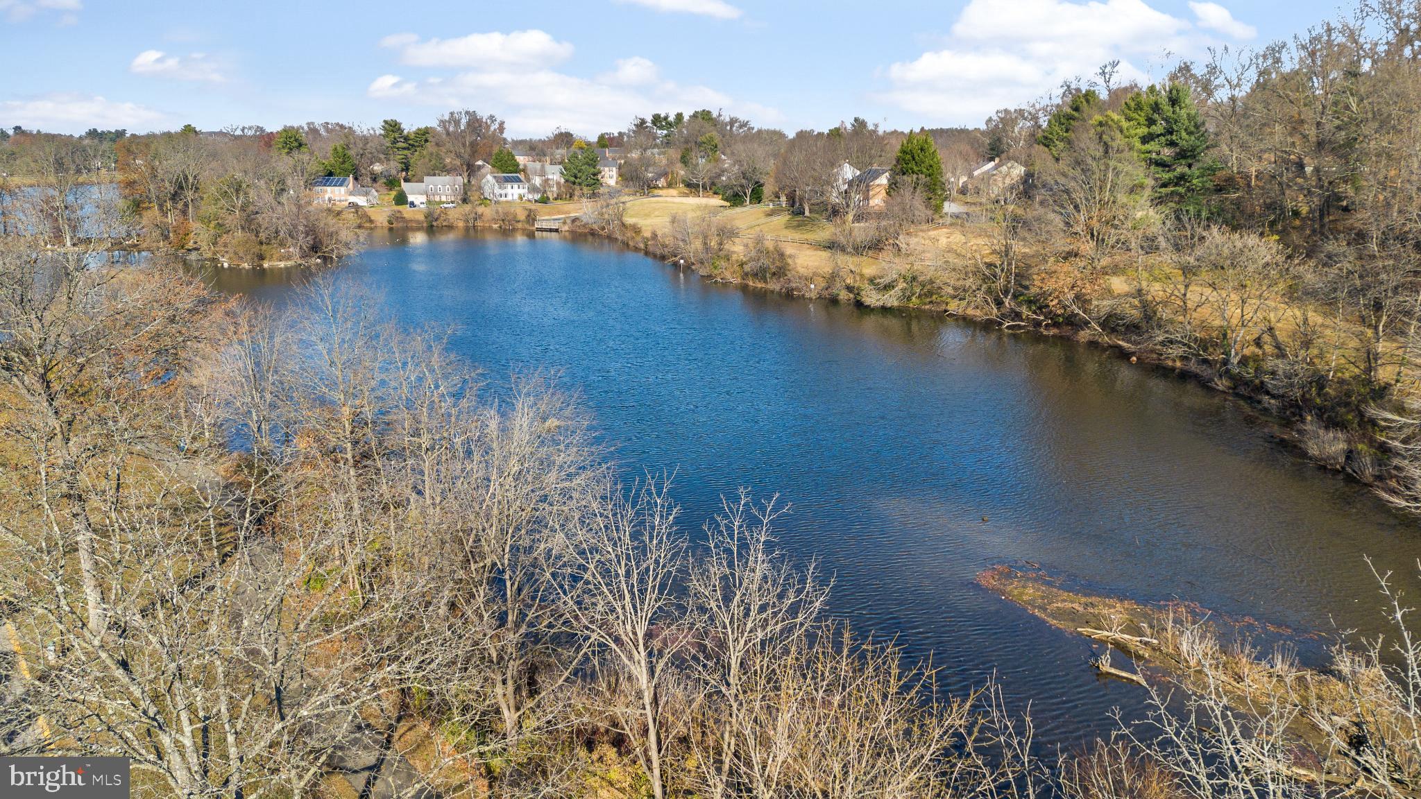 9802 Sailfish Terrace Gaithersburg, MD 20886 - Photo 16 of 18 a view of a lake with a mountain