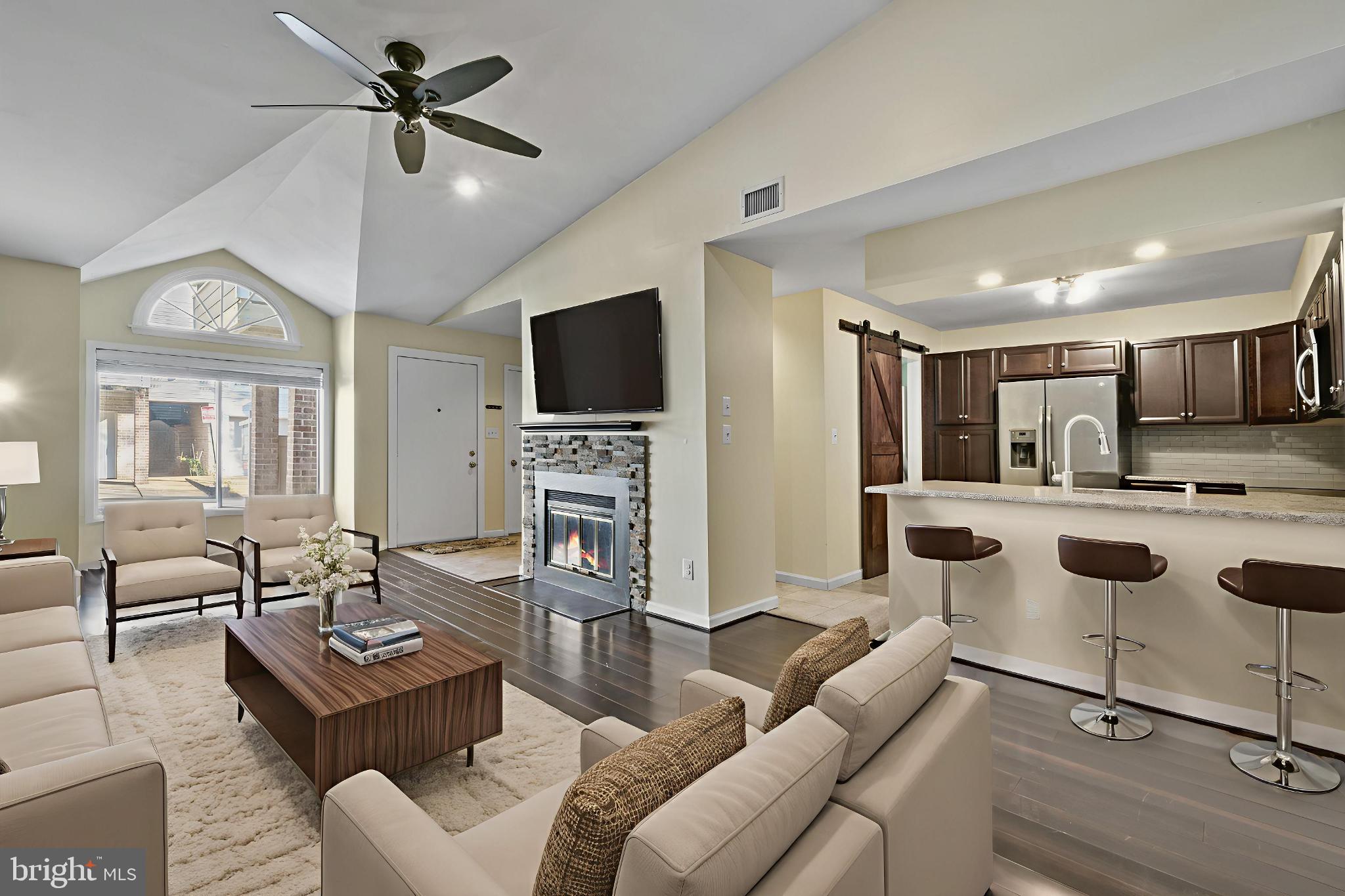 9802 Sailfish Terrace Gaithersburg, MD 20886 - Photo 5 of 18 a living room with furniture and a flat screen tv