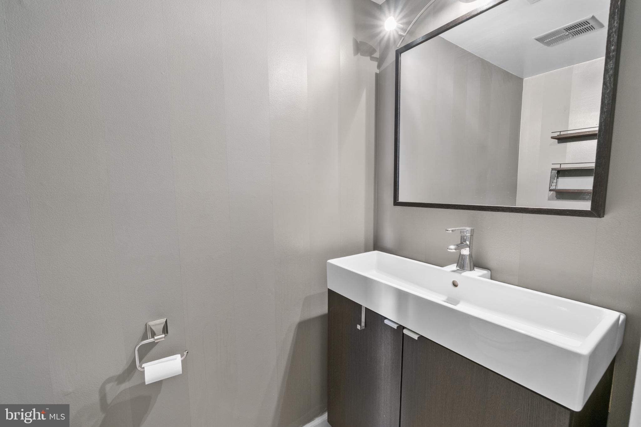 9802 Sailfish Terrace Gaithersburg, MD 20886 - Photo 8 of 18 a bathroom with a sink and a mirror