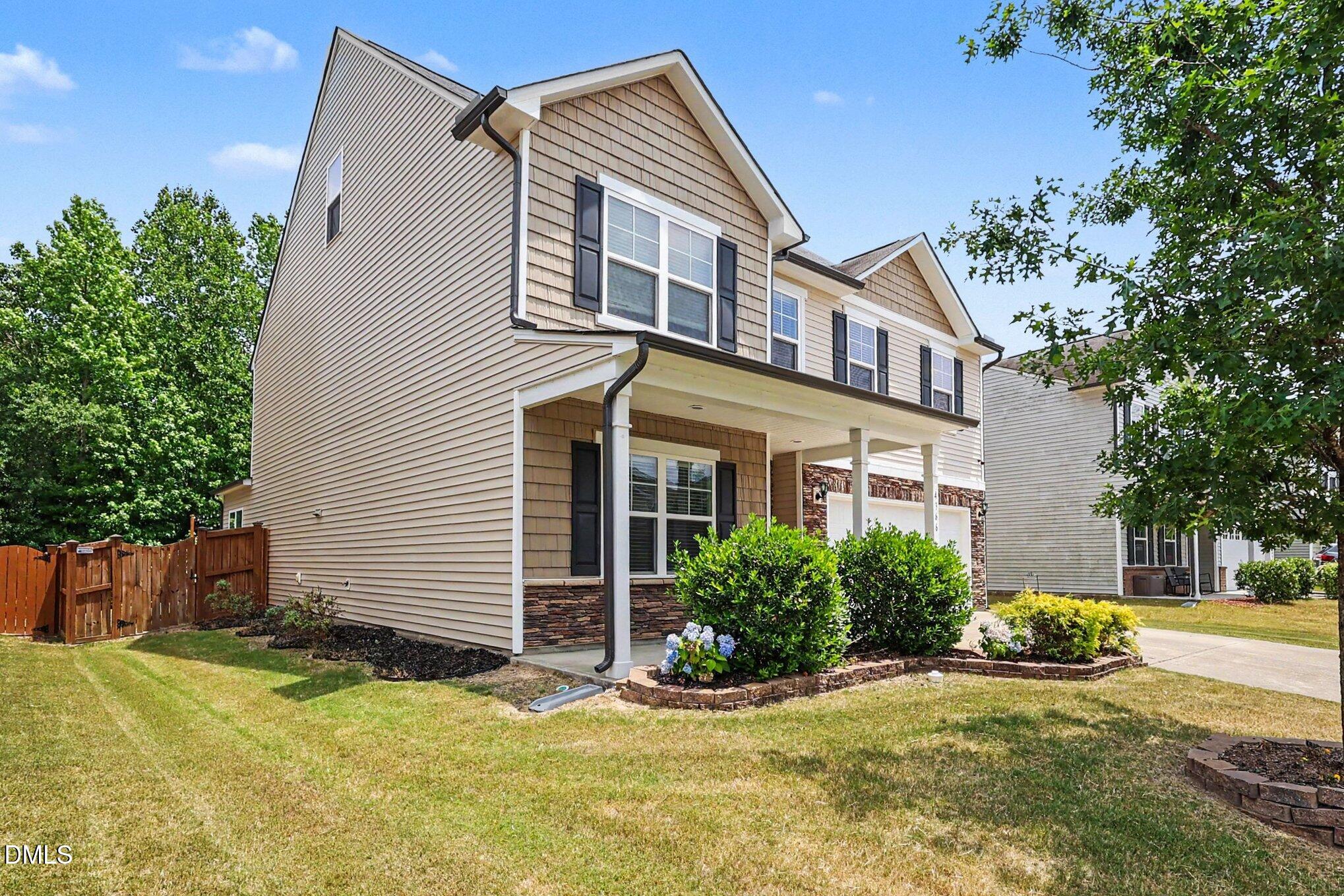 4366 Auburn Hills Drive Raleigh, NC 27616 - Photo 4 of 40 a front view of a house with a yard