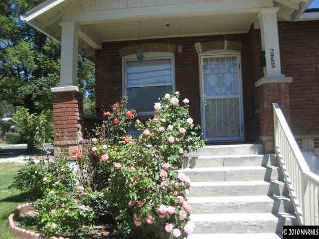 535 West 11th Street Reno, NV 89503 - Photo 2 of 4 a front view of house with flowers