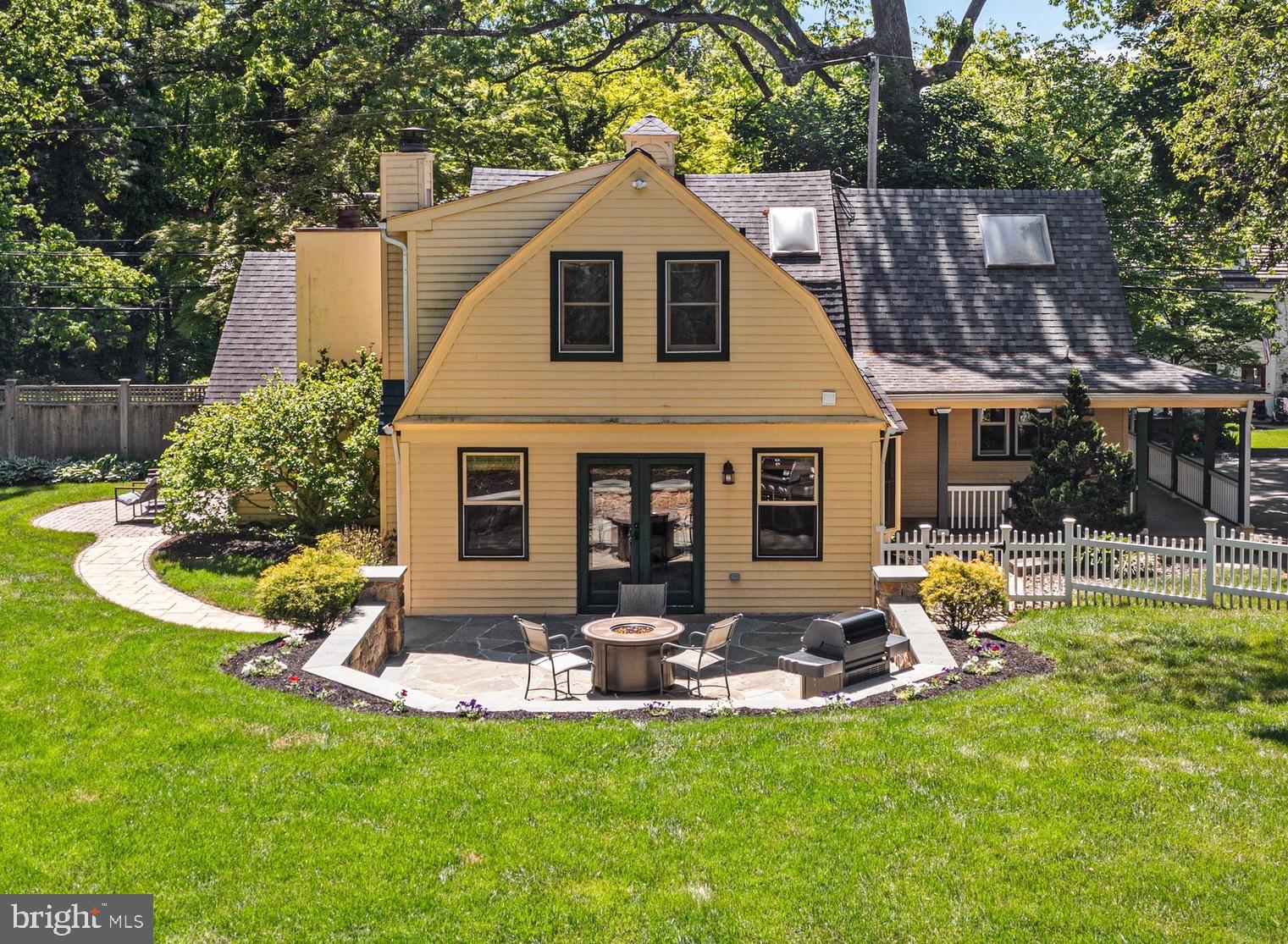 a view of a house with a yard patio and swimming pool