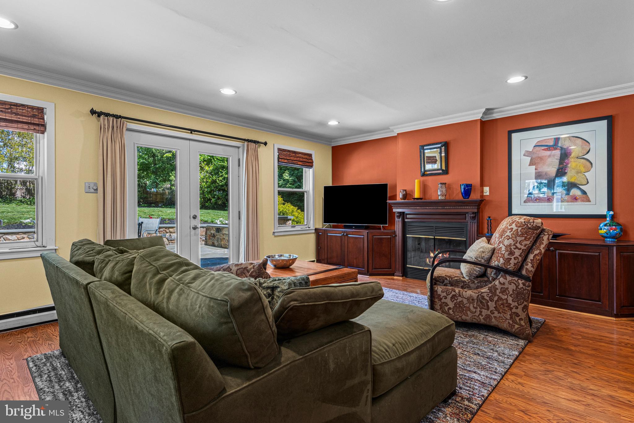 231 West Valley Road Wayne, PA 19087 - Photo 13 of 61 a living room with furniture a flat screen tv and a large window