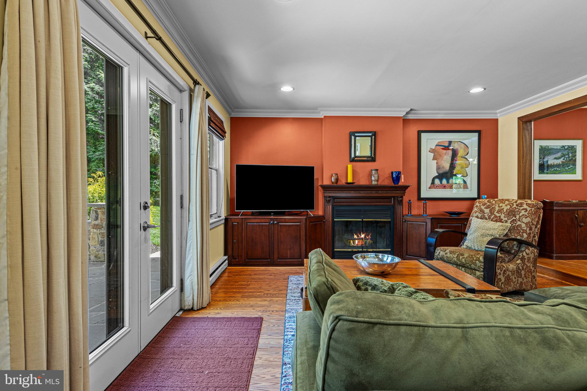 231 West Valley Road Wayne, PA 19087 - Photo 14 of 61 a living room with furniture a flat screen tv and a fireplace