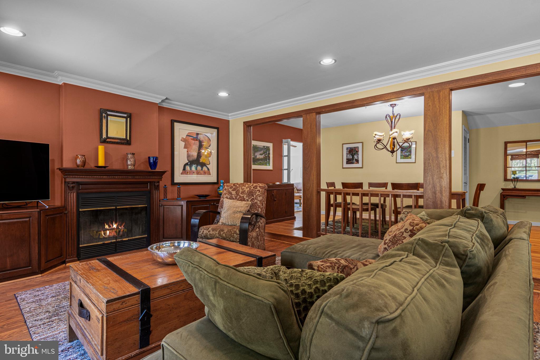 231 West Valley Road Wayne, PA 19087 - Photo 15 of 61 a living room with furniture a fireplace and a flat screen tv