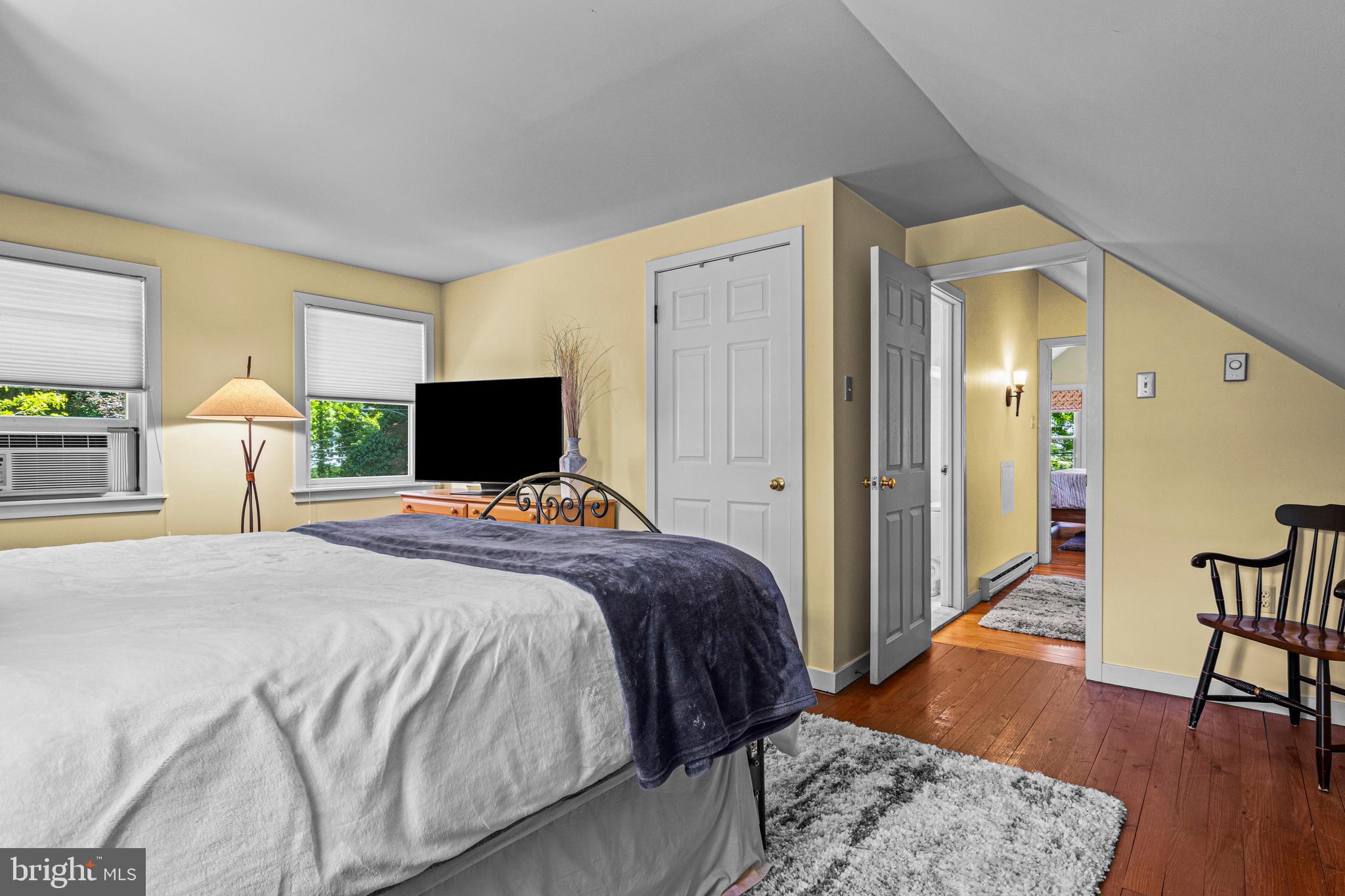 231 West Valley Road Wayne, PA 19087 - Photo 42 of 61 a bedroom with a bed and wooden floor