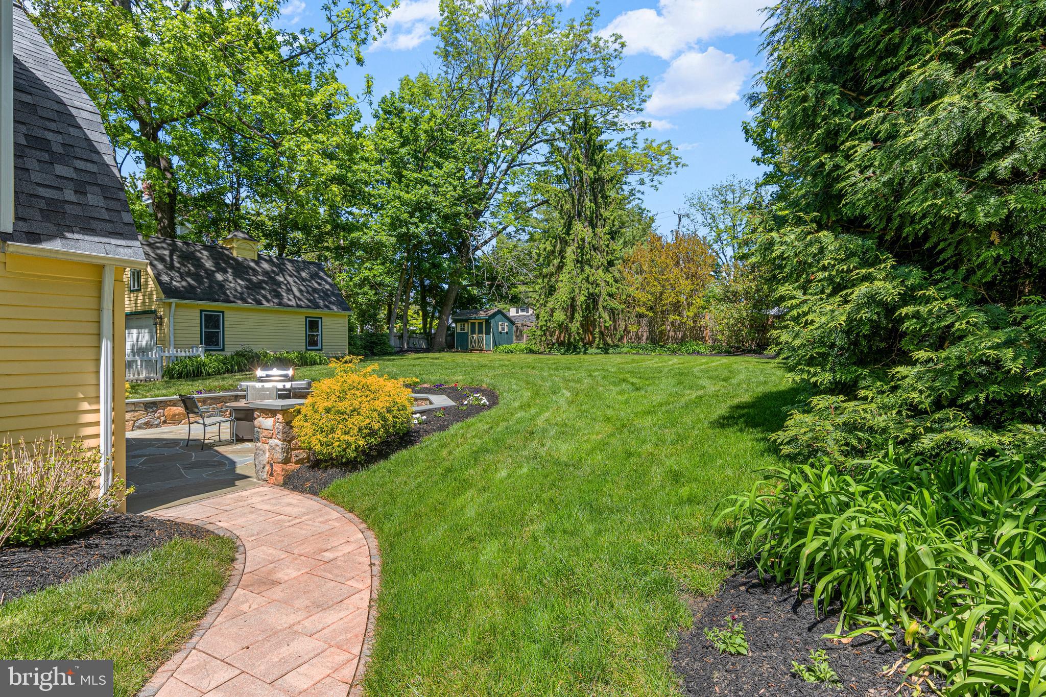 231 West Valley Road Wayne, PA 19087 - Photo 46 of 61 a view of a backyard with sitting area