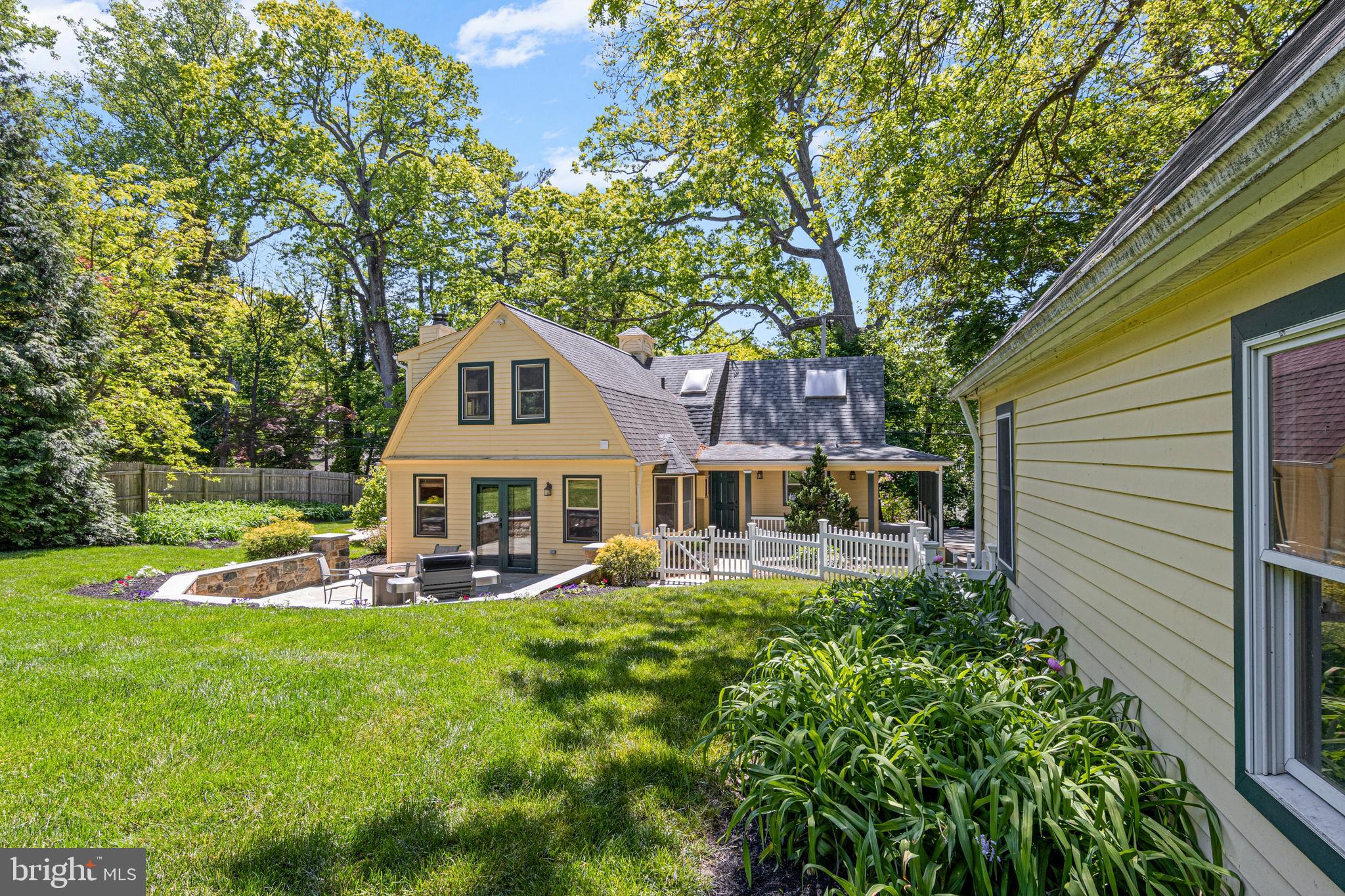 231 West Valley Road Wayne, PA 19087 - Photo 5 of 61 a front view of a house with garden and trees