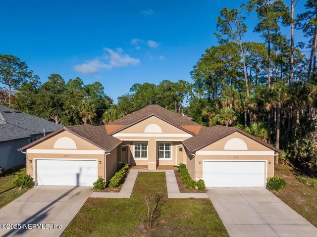 an aerial view of residential building and ocean