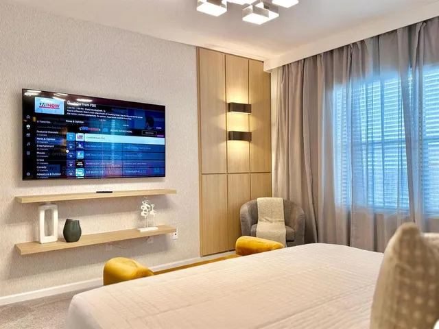 a bedroom with a bed and a cabinets