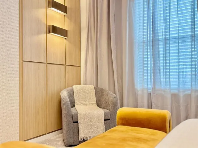 a living room with furniture and a shower