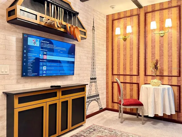 a view of a barbeque area with wooden fence