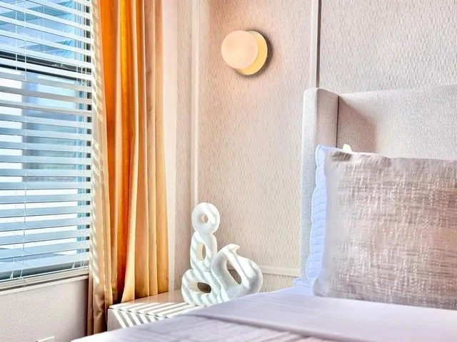 a bed room with a bed and a window