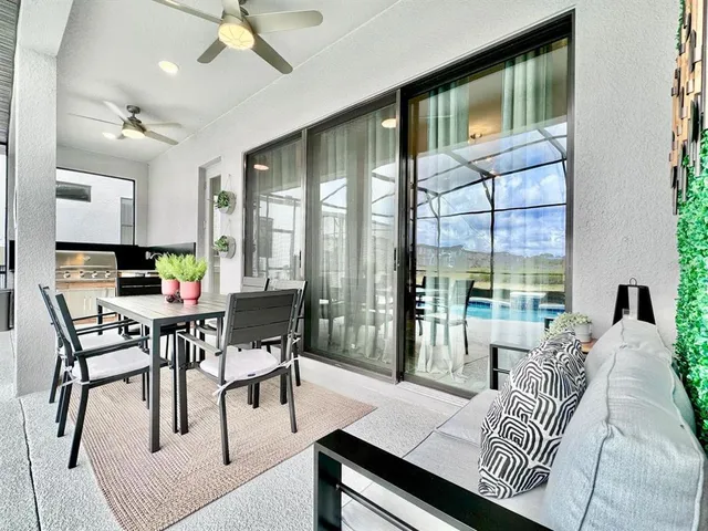 a view of living room filled with furniture and a potted plant