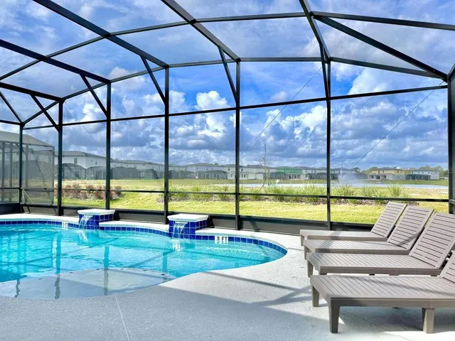 a view of a living room and kitchen