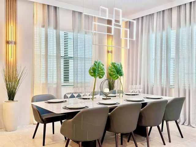 a dining room with furniture and window