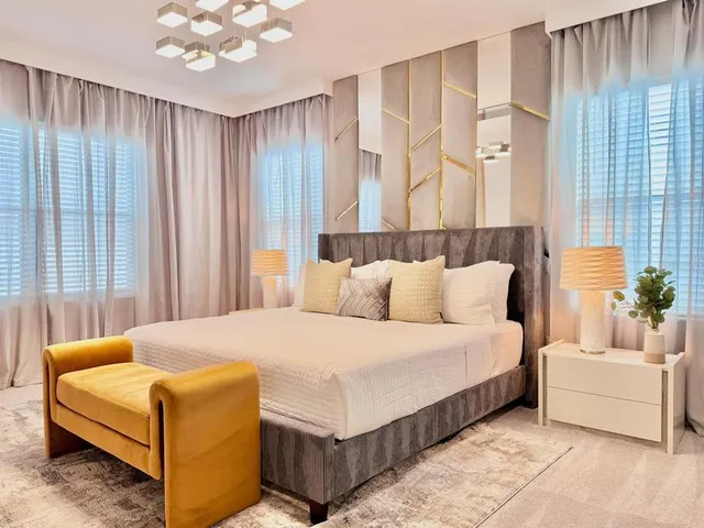 a bedroom with a bed and a couch