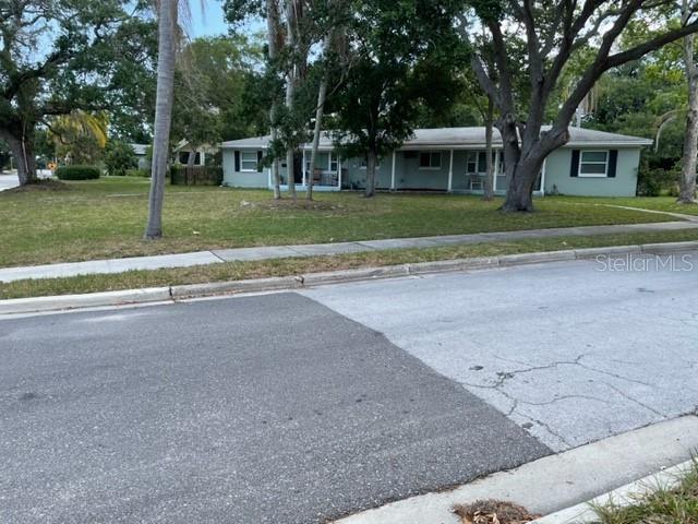 709 Indian Rocks Road Belleair, FL 33756 - Photo 11 of 19 a view of a house with a yard