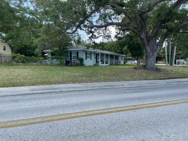 709 Indian Rocks Road Belleair, FL 33756 - Photo 14 of 19 a front view of a house with a garden