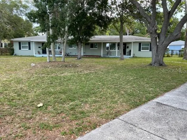 a view of a house with a garden