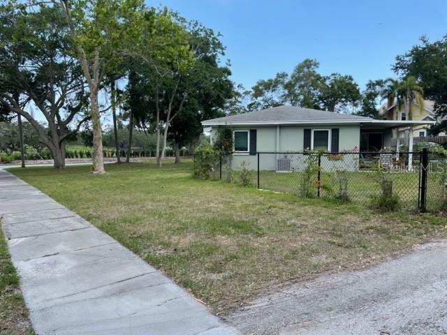 709 Indian Rocks Road Belleair, FL 33756 - Photo 19 of 19 a view of a yard in front of a house with large trees