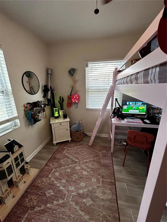 709 Indian Rocks Road Belleair, FL 33756 - Photo 2 of 19 a room with furniture and a wooden floor