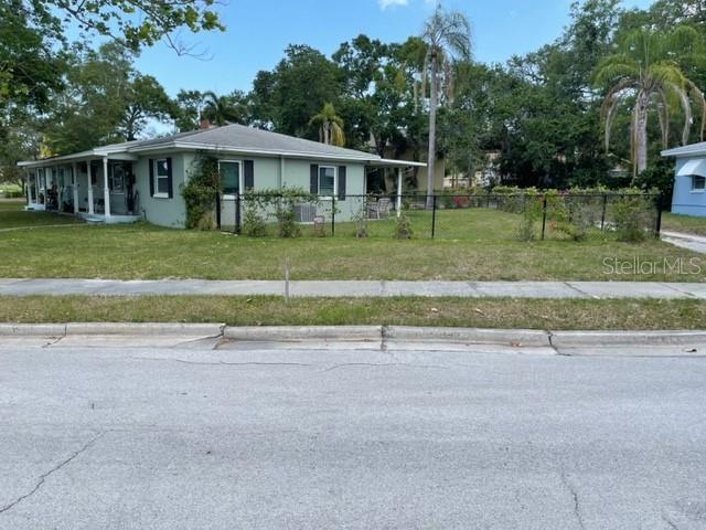 709 Indian Rocks Road Belleair, FL 33756 - Photo 9 of 19 front view of a house with a yard