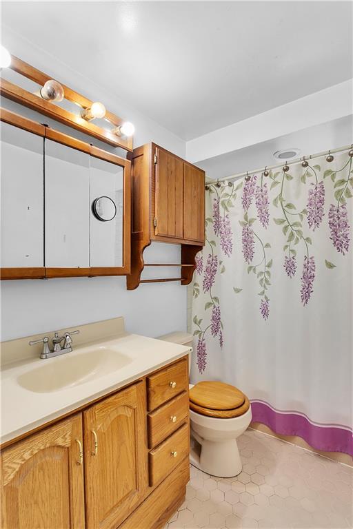 217 Center Church Road Canonsburg, PA 15317 - Photo 13 of 26 a bathroom with a granite countertop toilet sink and mirror