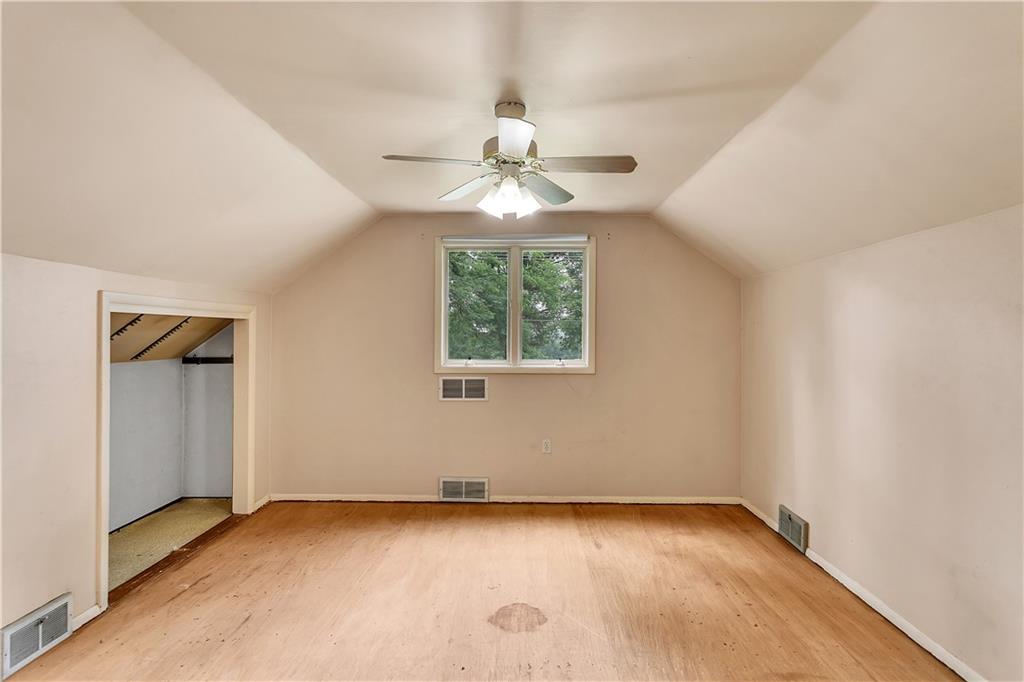 217 Center Church Road Canonsburg, PA 15317 - Photo 15 of 26 an empty room with a window and a ceiling fan