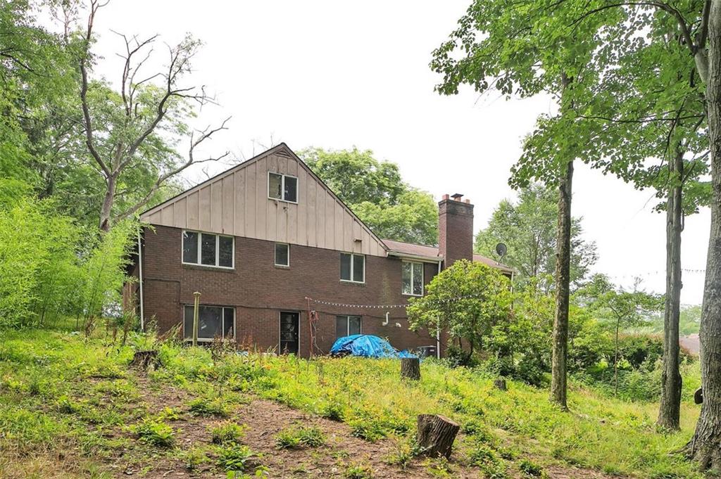 217 Center Church Road Canonsburg, PA 15317 - Photo 22 of 26 a front view of house with yard and trees around