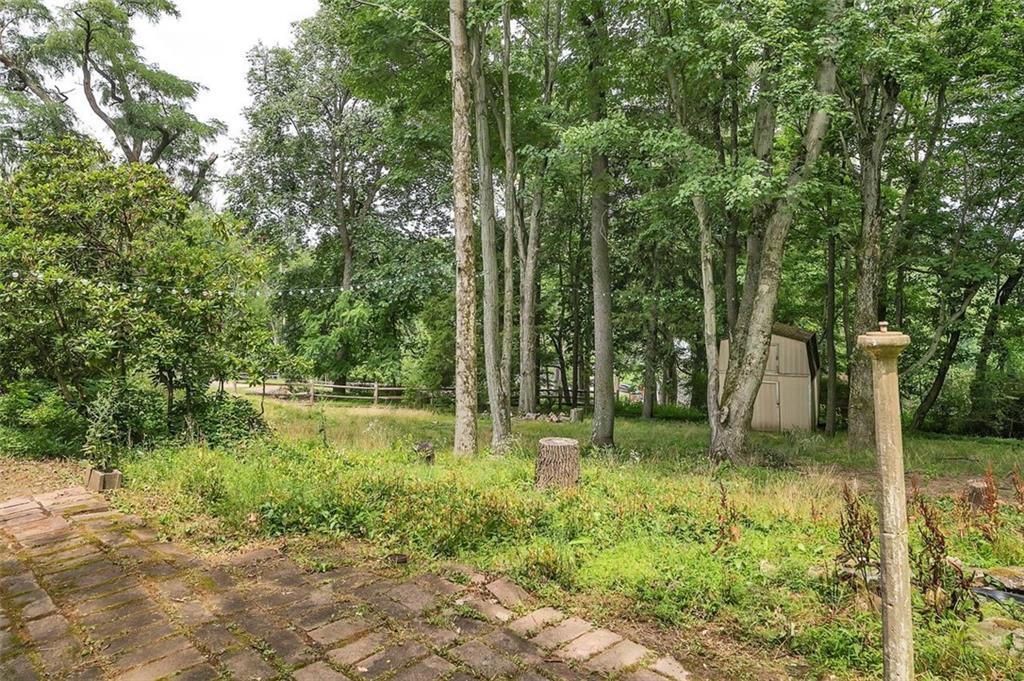 217 Center Church Road Canonsburg, PA 15317 - Photo 23 of 26 a backyard of a house with lots of green space and fountain