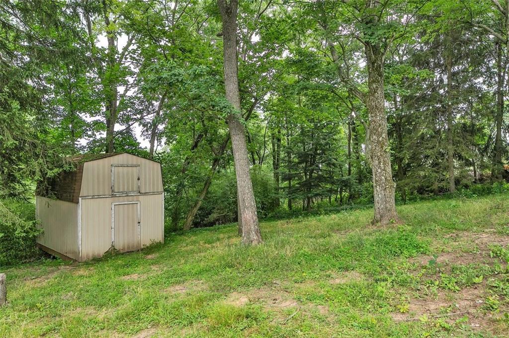 217 Center Church Road Canonsburg, PA 15317 - Photo 25 of 26 a backyard of a house with large trees and entertaining space