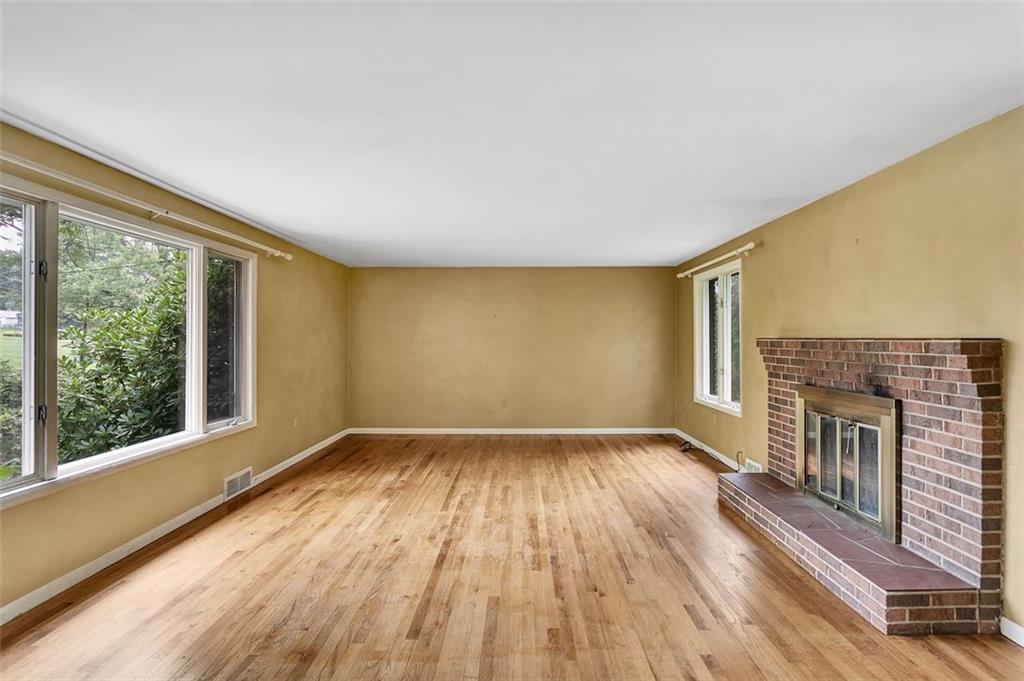 217 Center Church Road Canonsburg, PA 15317 - Photo 3 of 26 a view of an empty room with a fireplace and a window