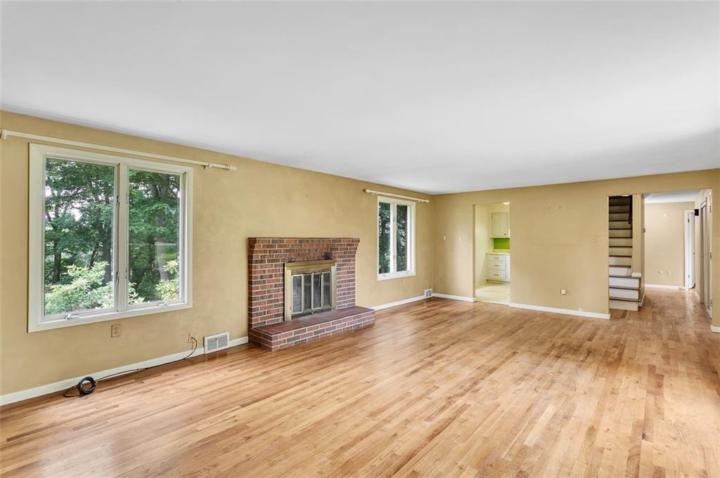 217 Center Church Road Canonsburg, PA 15317 - Photo 5 of 26 a view of empty room with wooden floor and fireplace