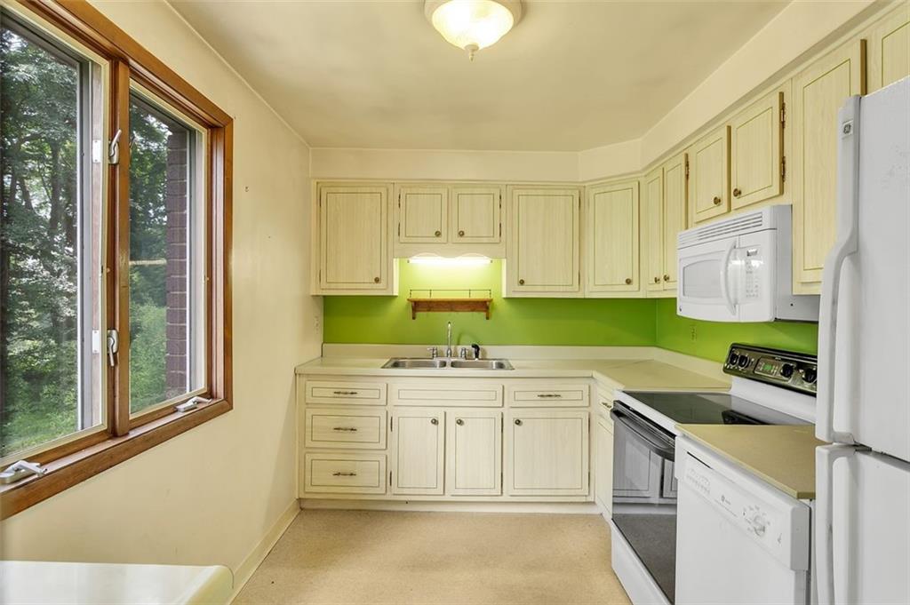 217 Center Church Road Canonsburg, PA 15317 - Photo 6 of 26 a room with a sink cabinets and a window