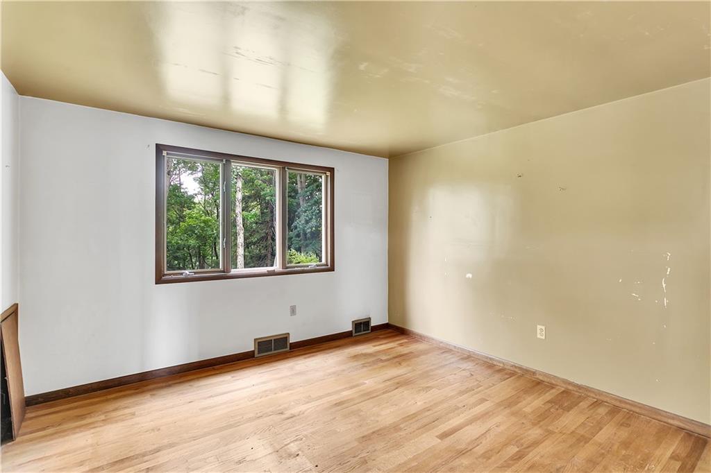 217 Center Church Road Canonsburg, PA 15317 - Photo 9 of 26 a view of an empty room with wooden floor and a window
