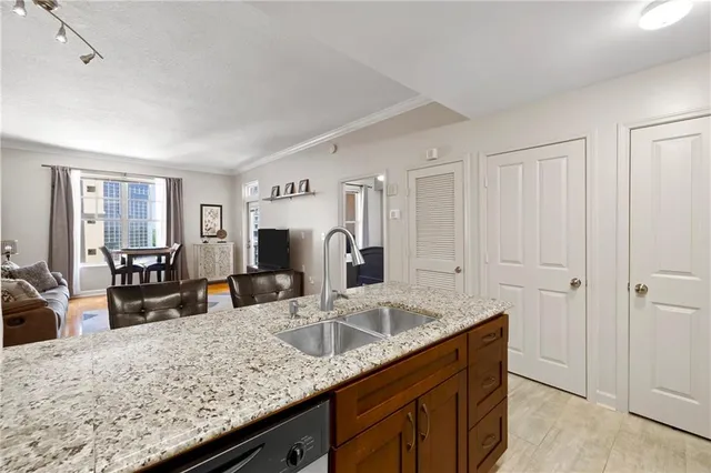 a kitchen with granite countertop a sink and counter space