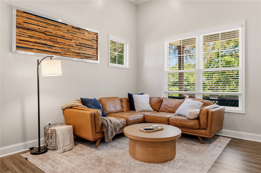 47 A Main Street Pelzer, SC 29669 - Photo 8 of 27 This bright living area features ample natural light, a cozy corner layout, and durable flooring.