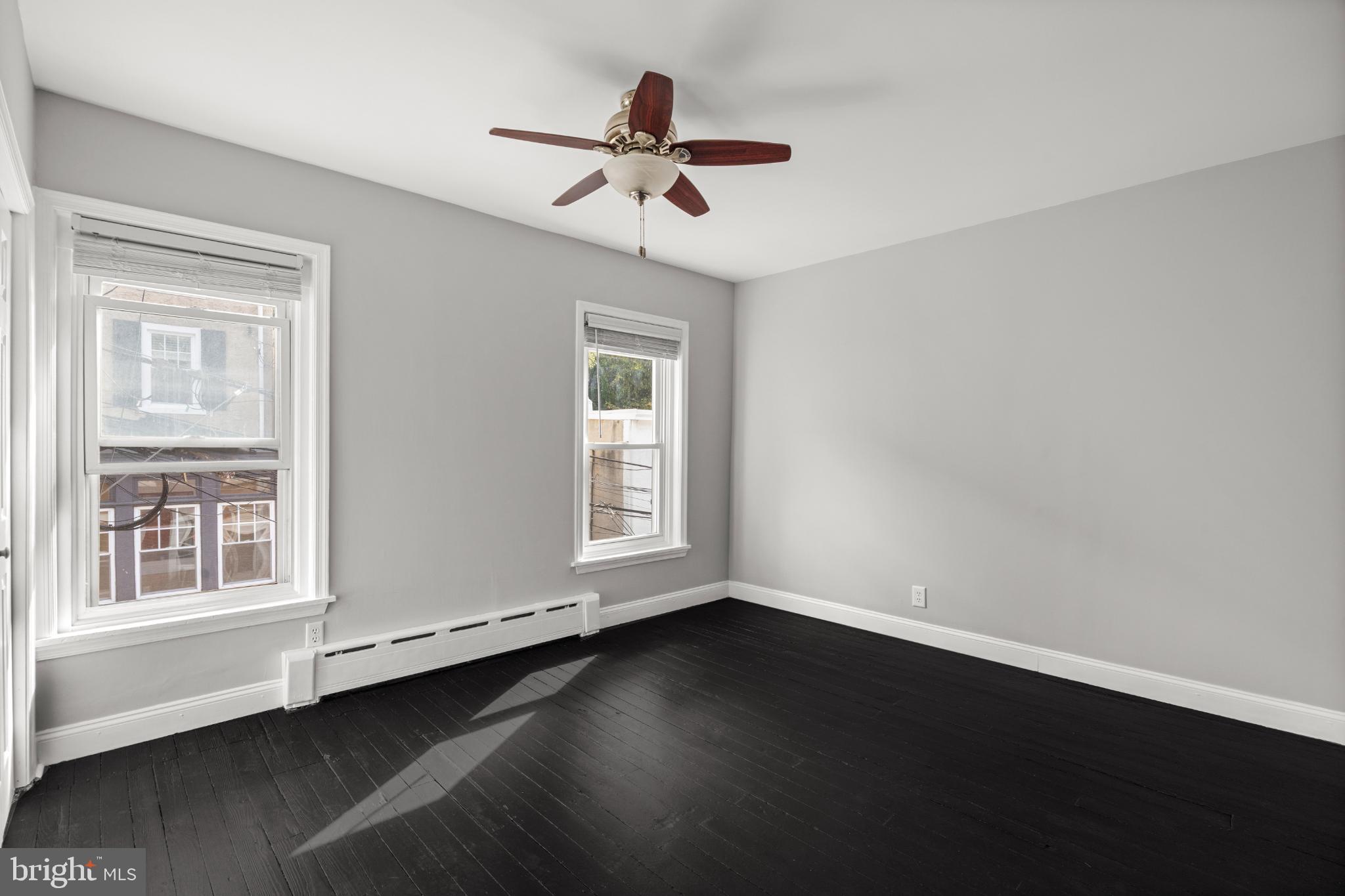 348 Carson Street Philadelphia, PA 19128 - Photo 14 of 27 a view of a livingroom with wooden floor and a ceiling fan