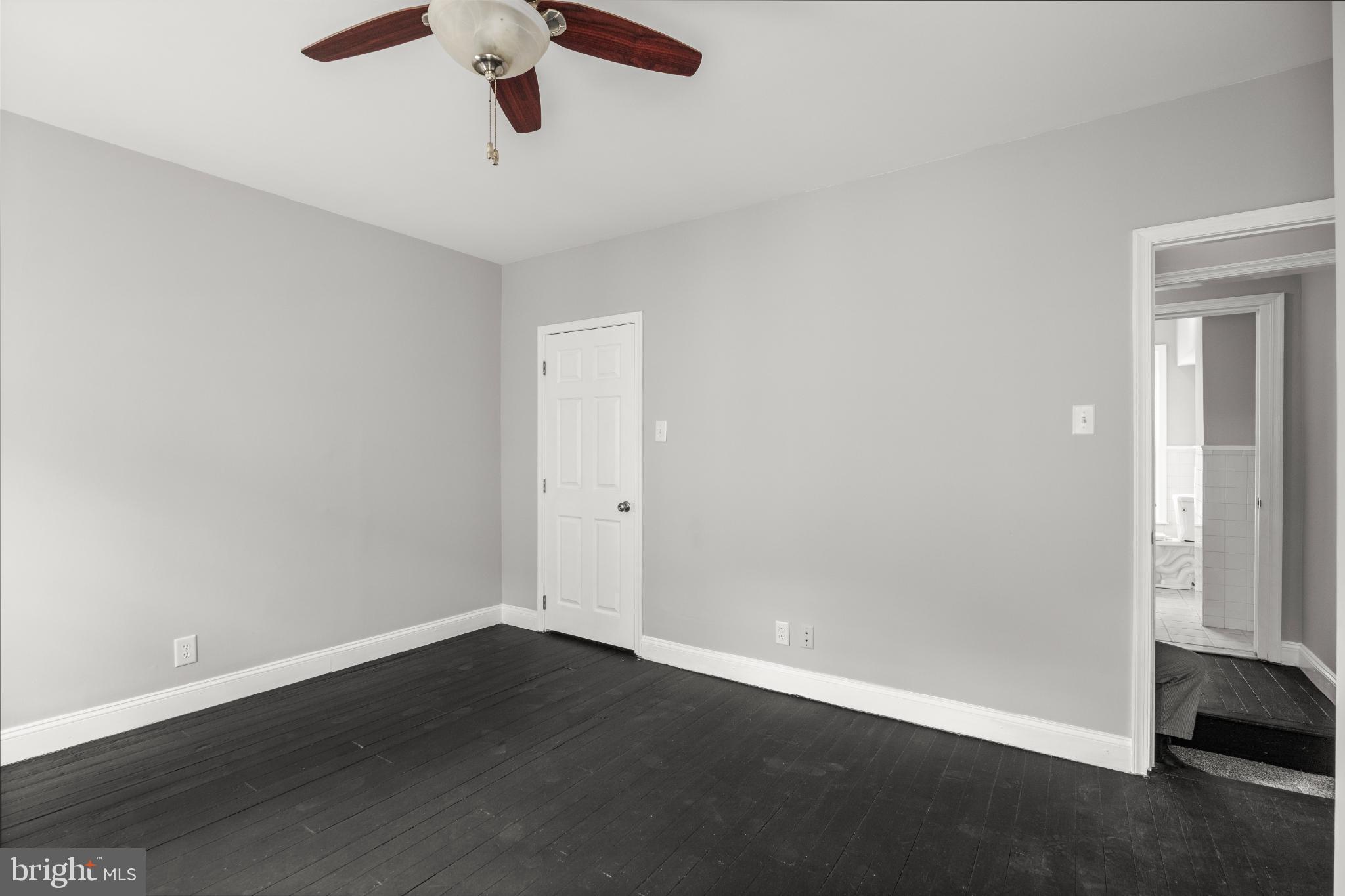 348 Carson Street Philadelphia, PA 19128 - Photo 15 of 27 an empty room with wooden floor and windows