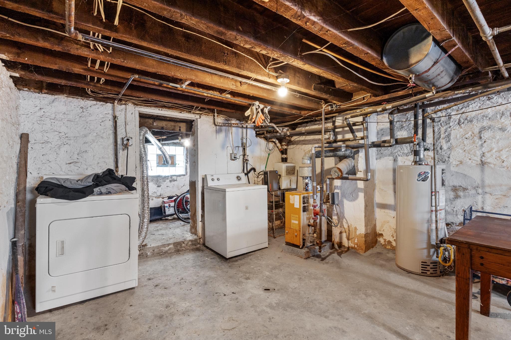348 Carson Street Philadelphia, PA 19128 - Photo 22 of 27 a view of storage and utility room with washer and dryer
