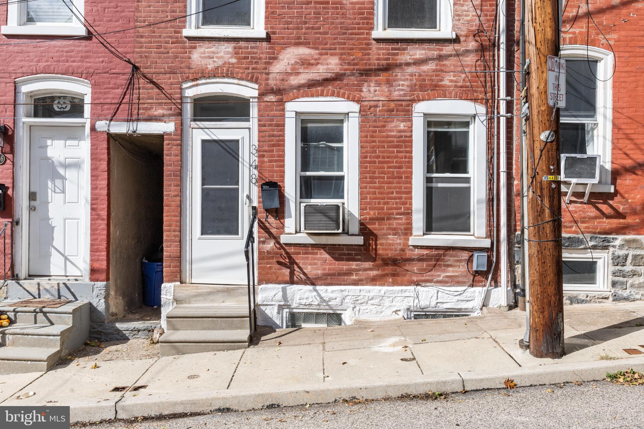 348 Carson Street Philadelphia, PA 19128 - Photo 25 of 27 front view of a brick house with a large window