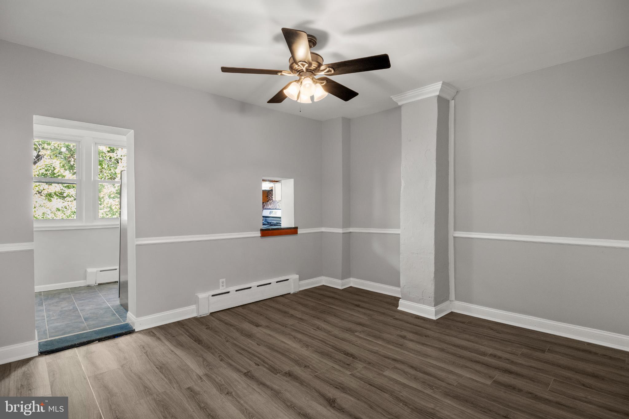 348 Carson Street Philadelphia, PA 19128 - Photo 6 of 27 wooden floor in an empty room with a window