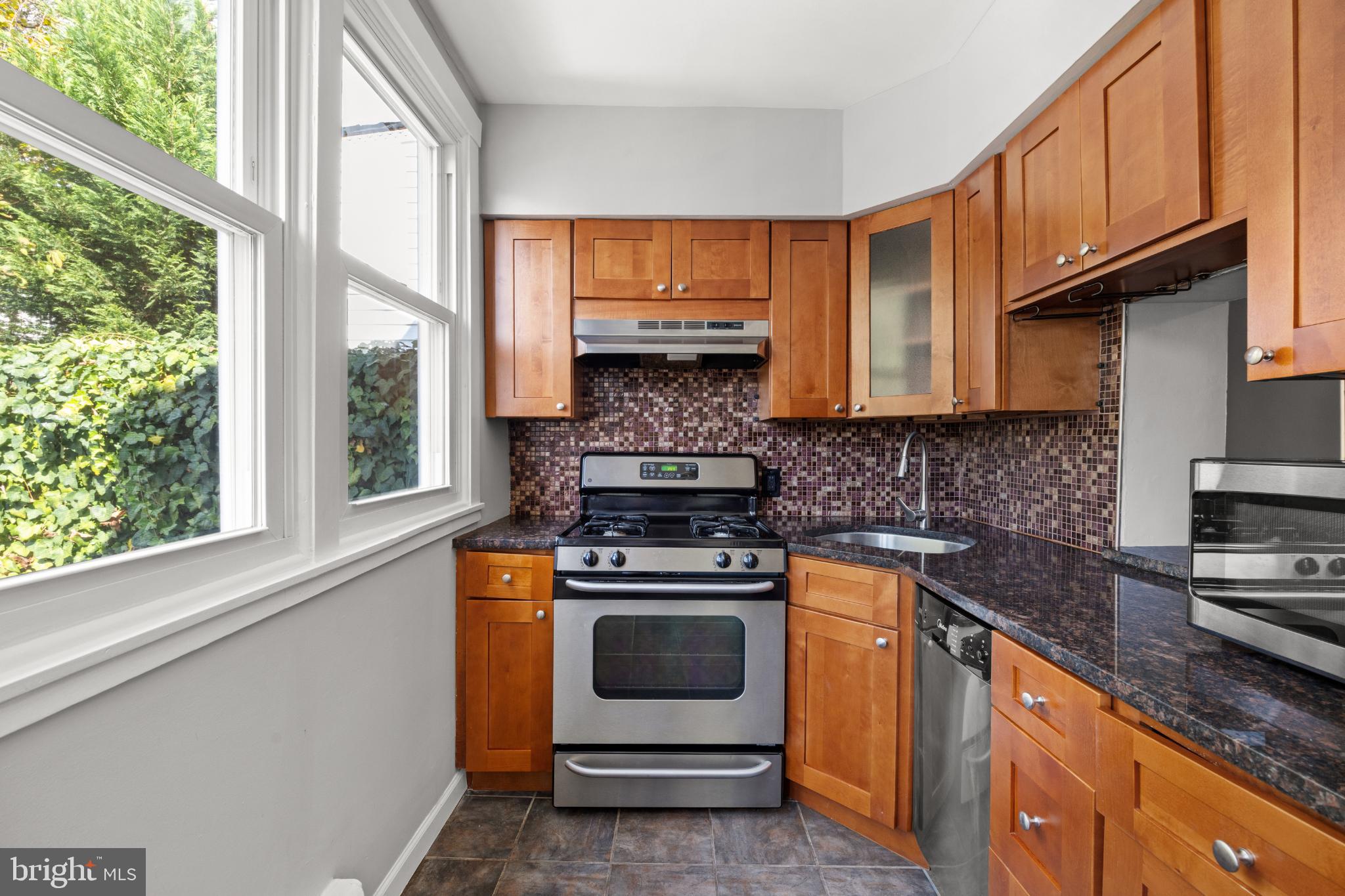 348 Carson Street Philadelphia, PA 19128 - Photo 9 of 27 a kitchen with a stove and a sink